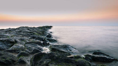 Scenic view of sea against sky during sunset