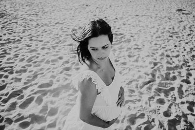 High angle view of woman looking at beach