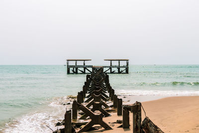 Lifeguard hut on beach against clear sky