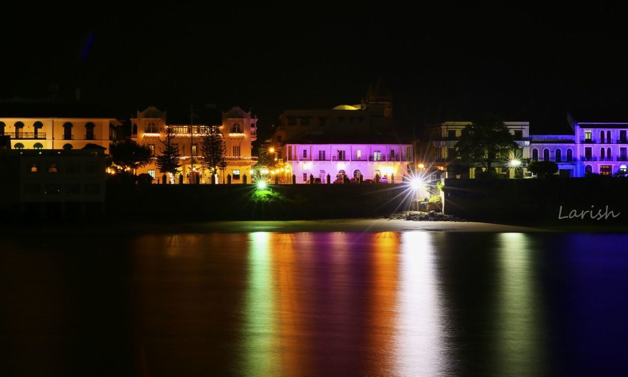 REFLECTION OF ILLUMINATED BUILDINGS IN WATER