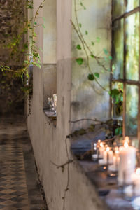 View of illuminated lamp by building