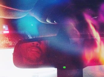 Close-up of woman looking through airplane window