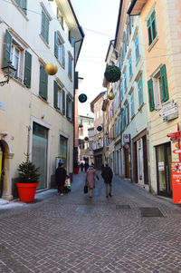 People walking on street in city