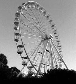 Low angle view of ferris wheel against sky