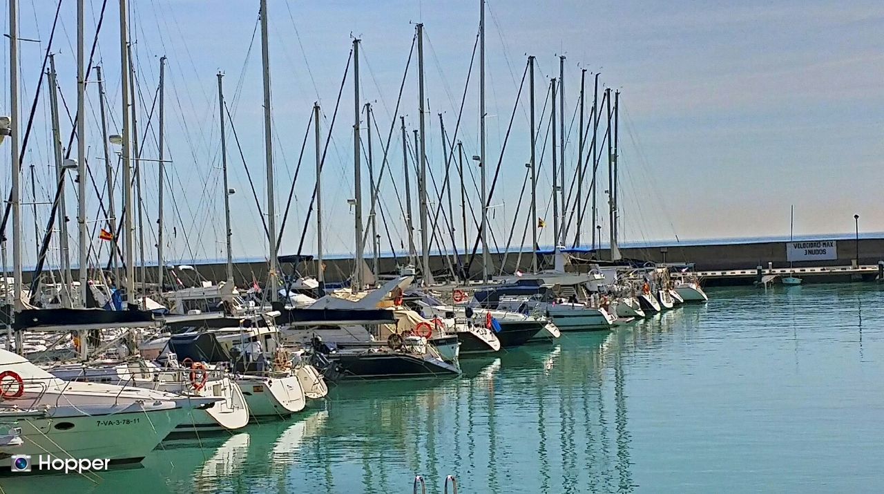 BOATS MOORED IN HARBOR