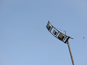 Low angle view of street light against clear sky