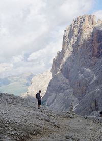 Man standing on land against sky