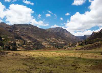 Scenic view of landscape and mountains against sky