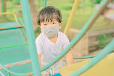 Portrait of cute boy in playground