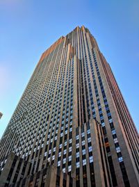 Low angle view of modern building against clear blue sky