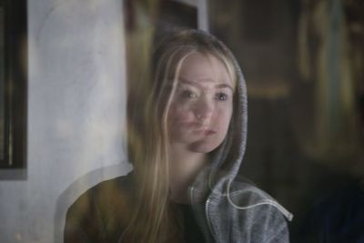 Close-up of young woman at home