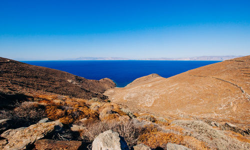 Scenic view of sea against clear blue sky