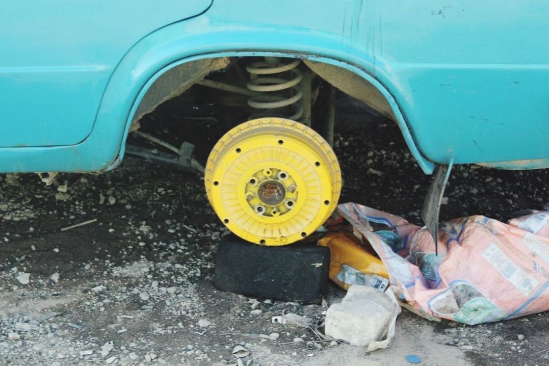 transportation, mode of transport, land vehicle, abandoned, obsolete, car, damaged, wheel, old, stationary, deterioration, run-down, rusty, yellow, day, close-up, metal, part of, travel, vehicle part