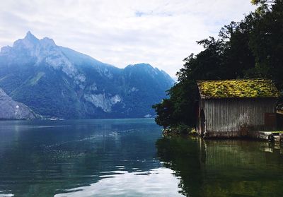 Scenic view of lake and mountains against sky