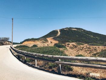 Scenic view of mountains against clear blue sky