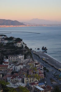 High angle view of townscape by sea