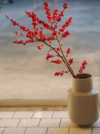 Close-up of red rose on table