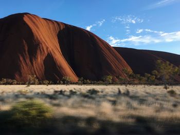 Surface level of land against sky at uluru
