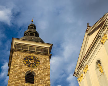 Low angle view of clock tower against sky