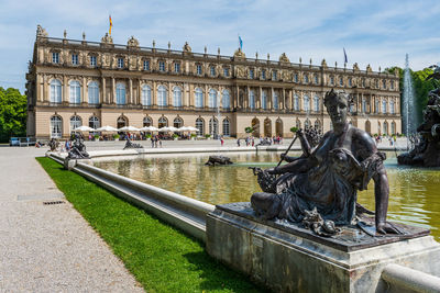 Statue in front of historical building