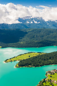 Scenic view of lake and mountains against sky