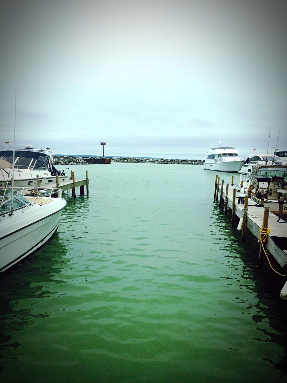 water, nautical vessel, transportation, sea, waterfront, boat, mode of transport, sky, pier, moored, rippled, built structure, clear sky, nature, tranquility, copy space, tranquil scene, travel, day, outdoors