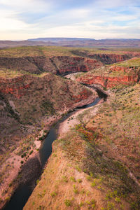 High angle view of river amidst landscape against sky