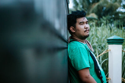 Portrait of young man looking away