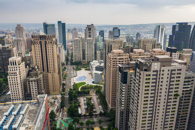 High angle view of buildings in city against sky