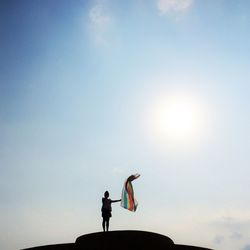 Low angle view of man against clear sky