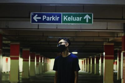 Man standing at railroad station