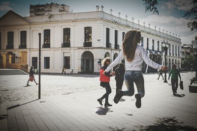 Woman standing on city street