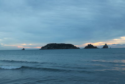 Scenic view of sea against sky at sunset