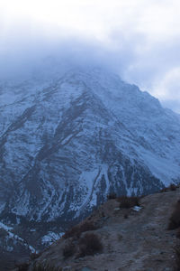 Scenic view of snowcapped mountains against sky