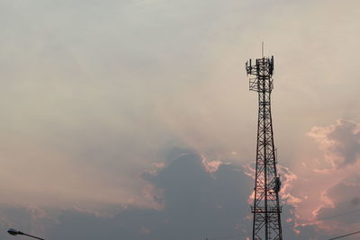 Low angle view of communications tower against sky