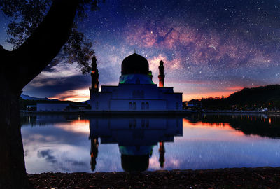 Floating mosque with milky way and reflection