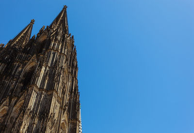 Low angle view of traditional building against clear blue sky