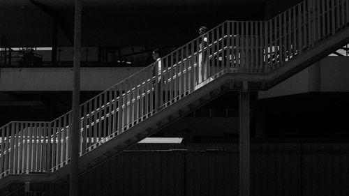 Illuminated staircase of building in city at night