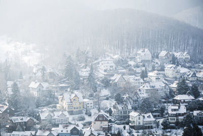 High angle view of buildings in city during winter