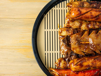 Close-up of meat on barbecue grill