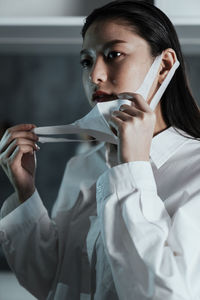 Portrait of a young woman smoking