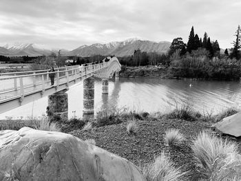 Bridge over river against sky