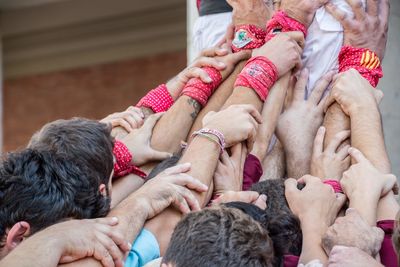 People holding hands during traditional festival