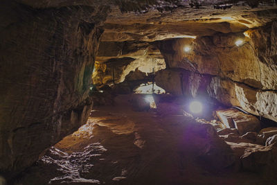 Low angle view of illuminated cave