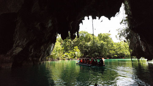 Group of people on boat in river