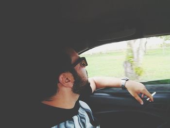 Man sitting in car