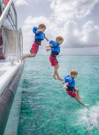 Little boy playing on slide