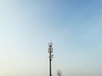 Low angle view of communications tower against sky