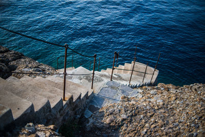 High angle view of steps leading towards sea in camogli