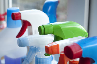 Close-up of spray bottles in kitchen